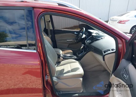 2014 Ford Escape Titanium z USA, uszkodzony, nr VIN 1FMCU0J9XEUA89585
